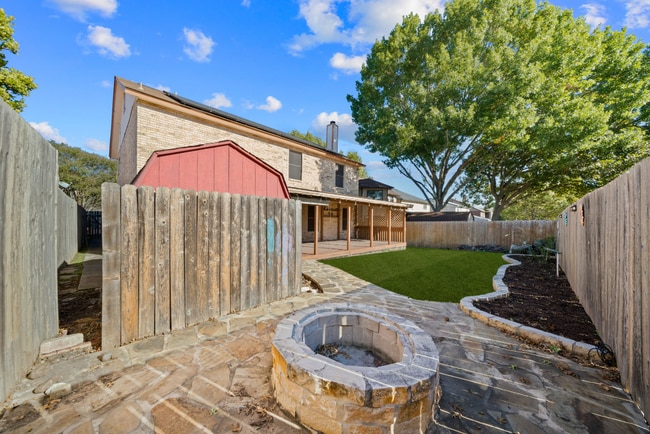 Building Photo - Sign your lease and receive a FREE 50" TV!!!  "Spacious 4-Bedroom Retreat with Fireplace in Charm...