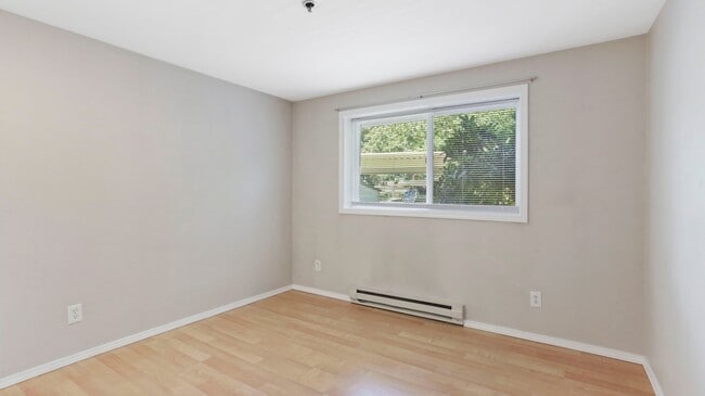 Building Photo - This ground floor corner-unit condo