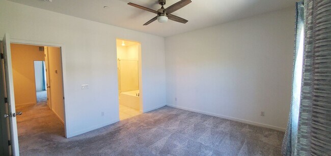 Building Photo - Beautiful townhome features a bright, open-concept layout
