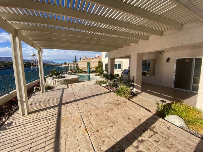 Building Photo - Vegas's Only Available Waterfront Rental ~ 4 Bedroom Desert Shores Lake Front Home