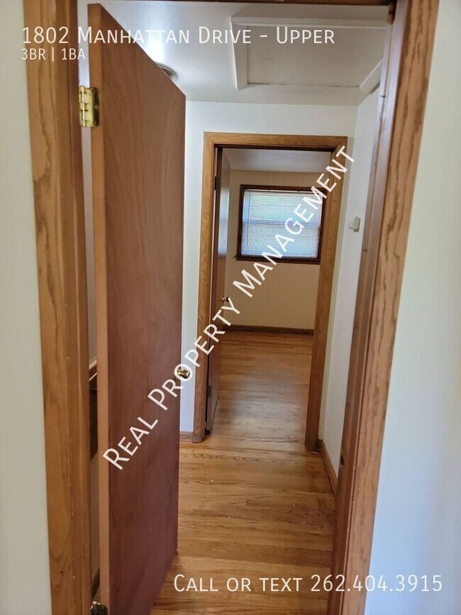 Building Photo - 1802 Manhattan Dr