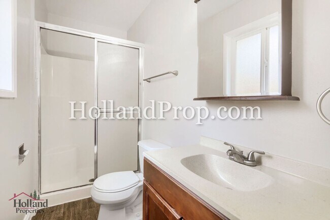 Building Photo - Charming 3-Bedroom Duplex with Fenced Yard, Fireplace & Garage Near Hwy 26!