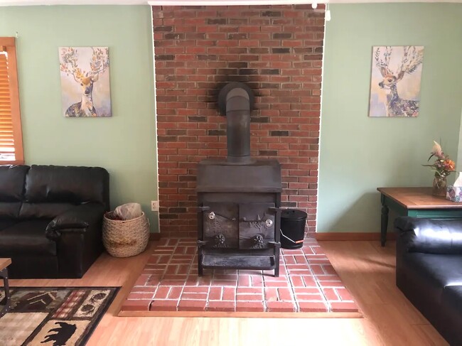 Upstairs Living room with wood stove - 94 Brookside Dr