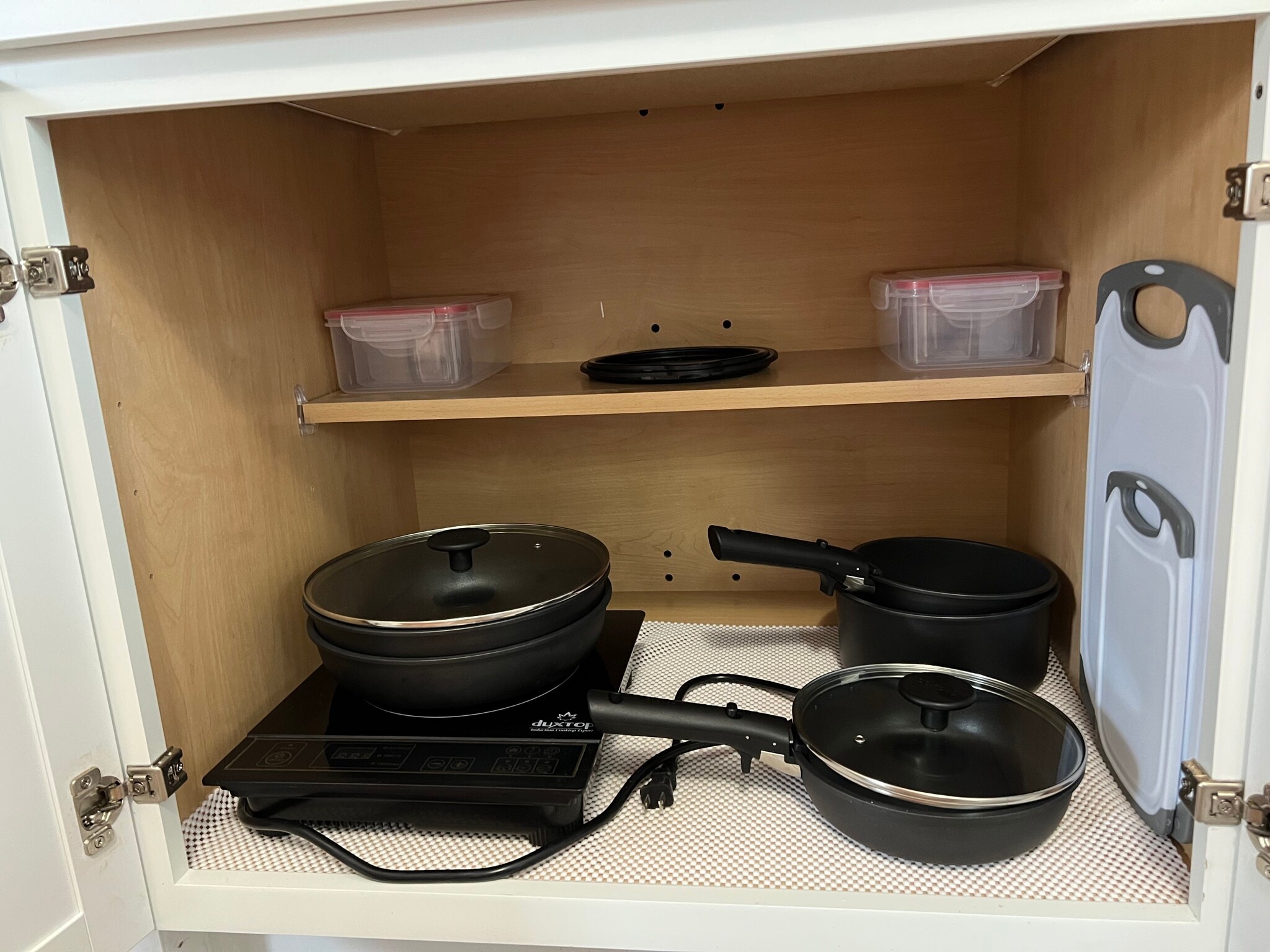 A hot plate and pans are available for use. Storage containers for leftovers. - 908 Lake Rd