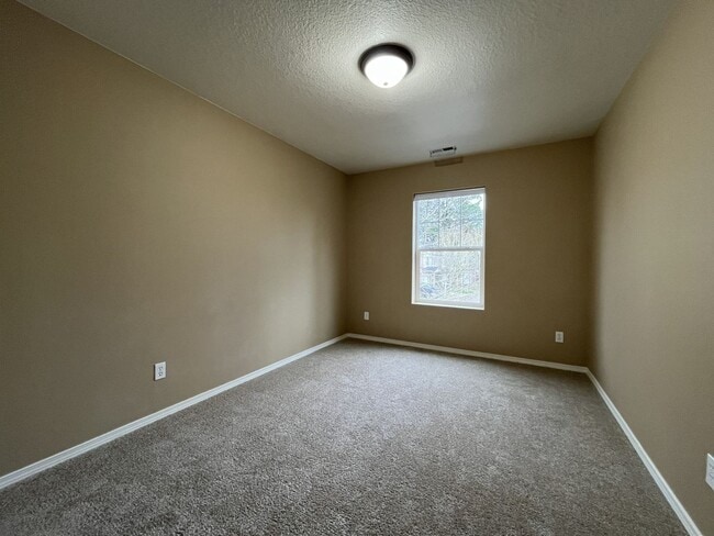 Building Photo - Inviting Two-Story 3BR Home Featuring New Carpet, New Stainless Appliances, Spacious Garage Stora...