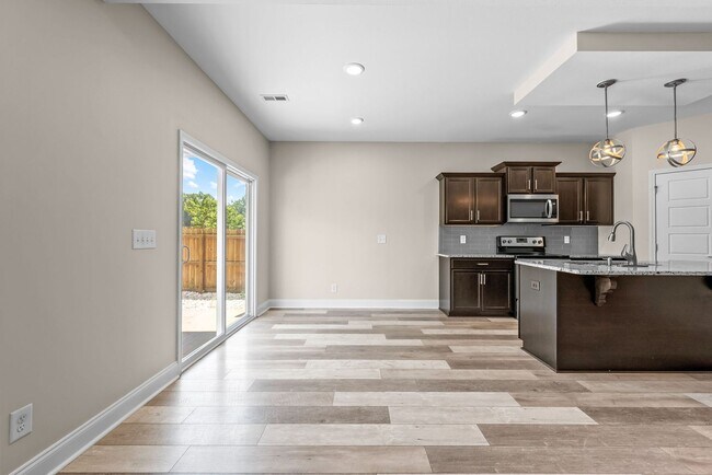 Building Photo - Pet Friendly Three Bedroom with Bonus!