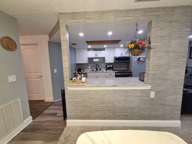 Building Photo - Second Floor Annual rental available now in the 55+ condominium community of Cedar Woods.
