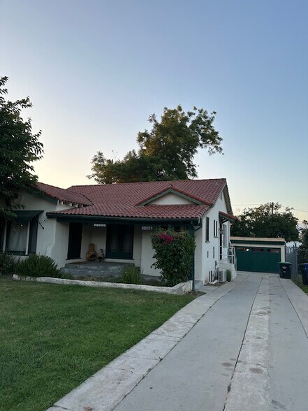 View of the duplex with a separate cottage in the back. - 24606 University Ave