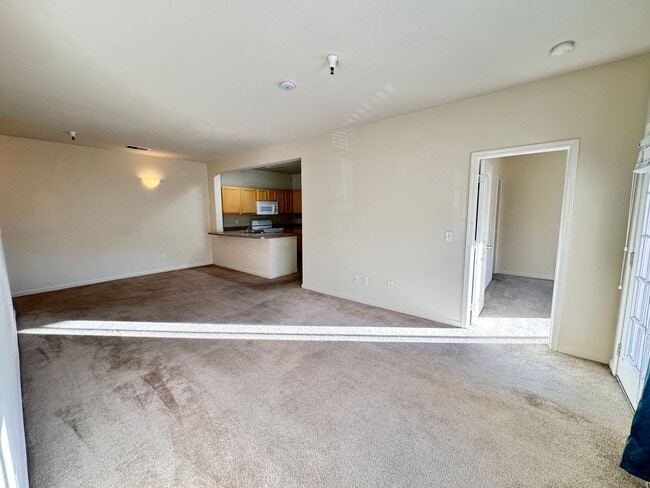Building Photo - Home Near UNR: Spacious 4BR/4BA with Gated Access and Balcony!