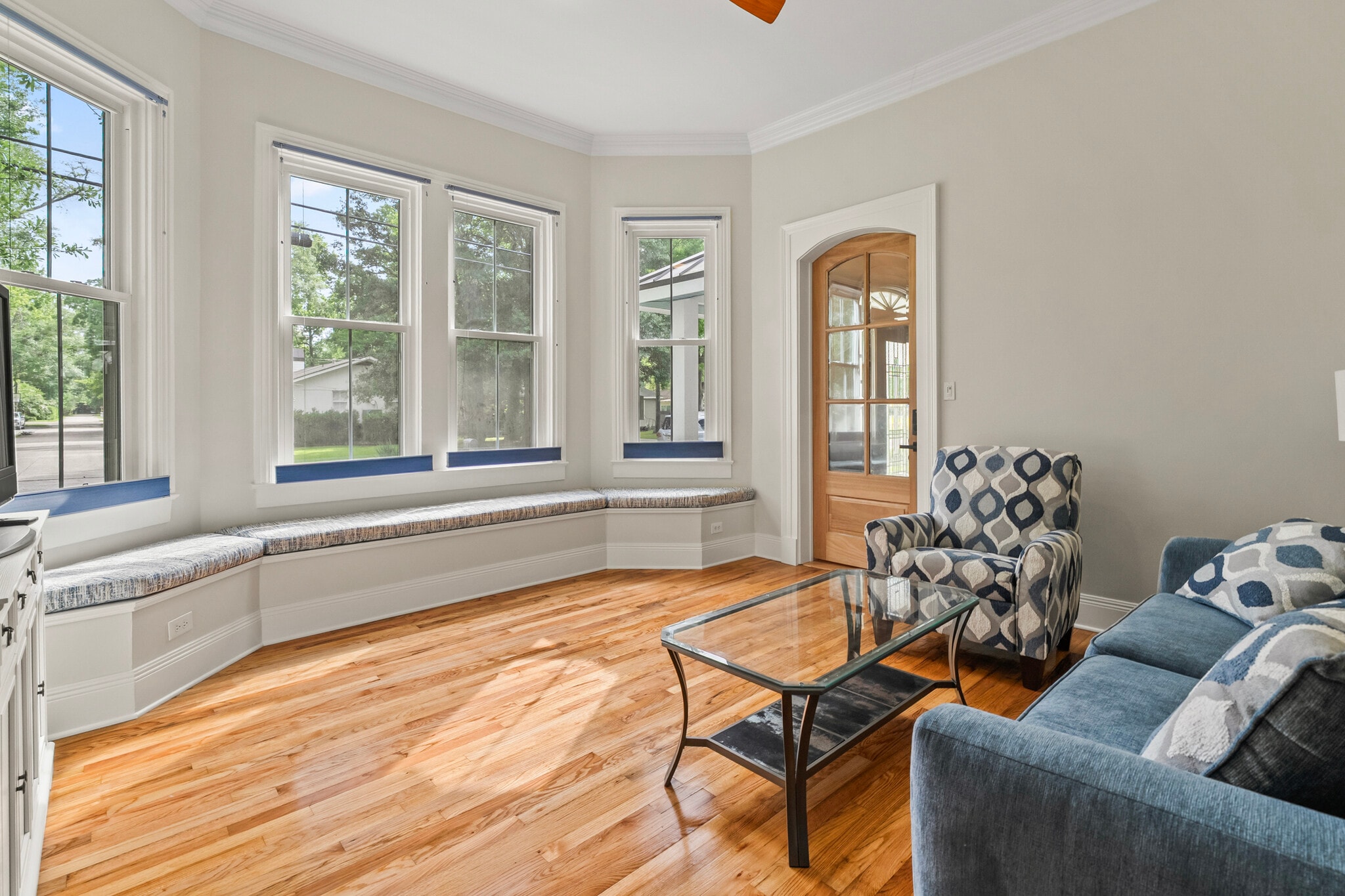 Entry door and bright front windows with adjustable shades - 305 E 14th Ave