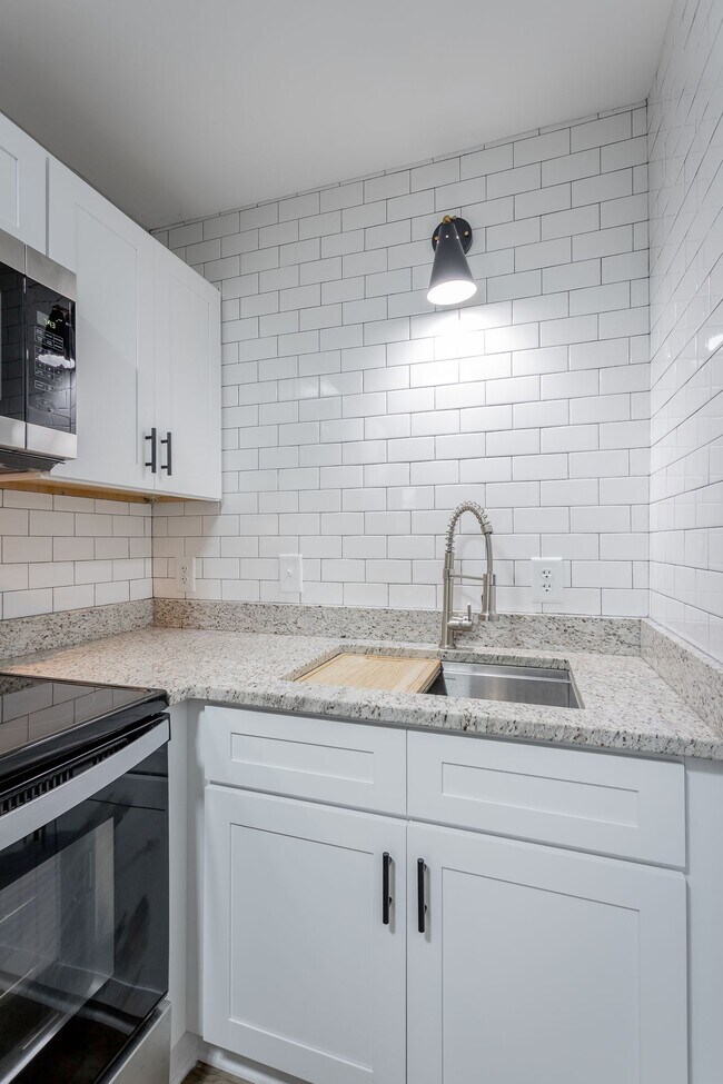 Building Photo - Discover Modern Living at Genesis Apartmen...