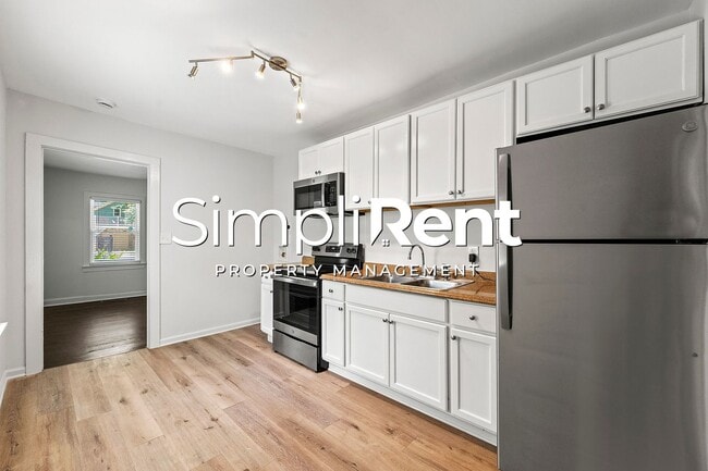 Building Photo - PRICE REDUCED! 1st month's Rent FREE with a 13-month lease!