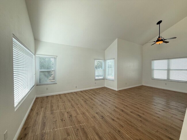 Building Photo - Corner Lot Beauty with Open Living, Guest Suite Down & Expansive Backyard