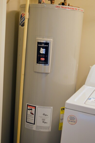 Hot water heater and washer/dryer - 11696 Palm Desert Pl