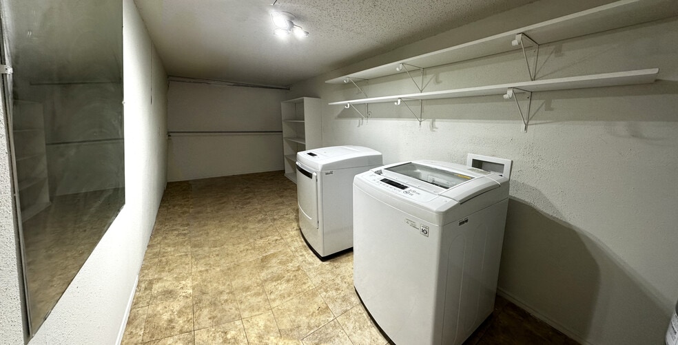 The 1st floor includes this huge laundry/storage space, a 2-car garage and an entry area - 8710 Park Ln