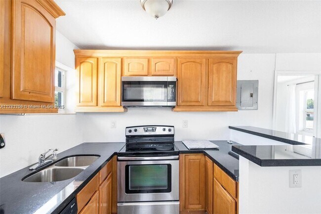 Building Photo - 6221 NW Miami Ct
