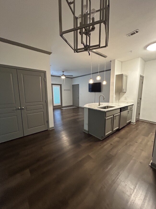 View from dining room to kitchen and living room - 400 Bucksley Ln