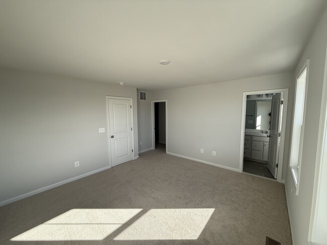 Upstairs, master bedroom, full bath and walk in closet - 5977 Cling Ln