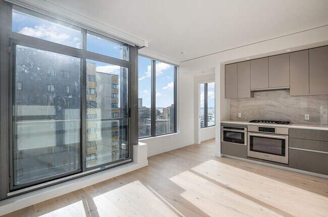 Building Photo - Urban Oasis at Spire Condominiums – Modern...