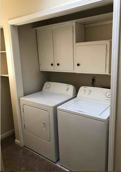 New washer and dryer unit with a lot of storage. The laundry room is next to the closet of bedroom 1. - 4968 New Haven Ave