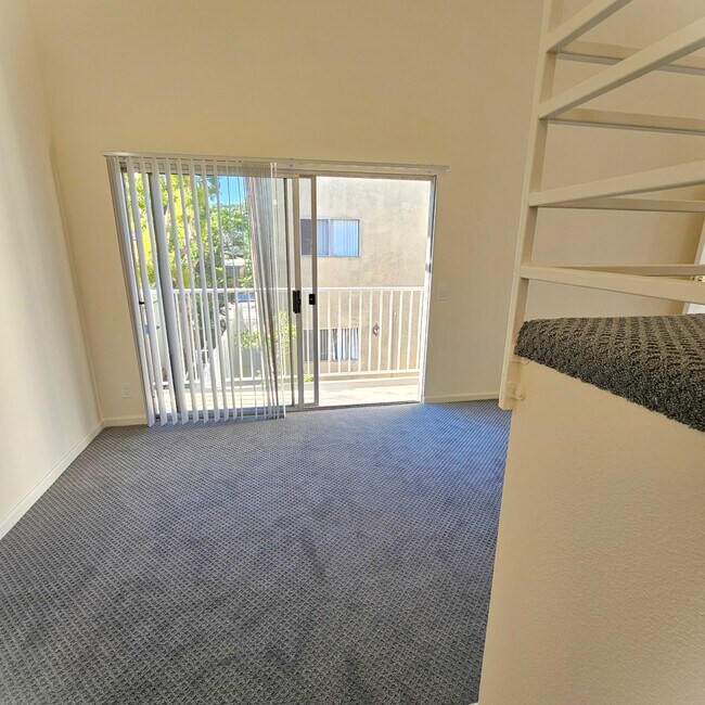 livingroomwithpatio - 10770 Palms Blvd