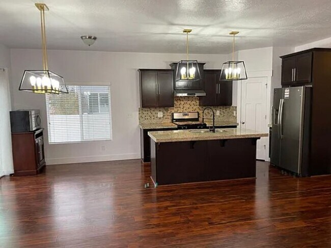 Building Photo - Spacious 4-Bedroom Home with Finished Basement in Taylorsville