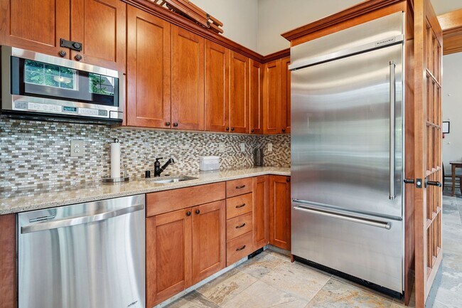 Building Photo - 2 Creeks Condominiums - Gated Community on...