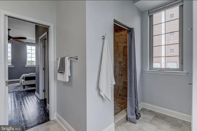 Building Photo - Beautiful EOG 3 bedroom  2.5 bath townhome with a 2 car garage and roof top deck overlooking the ...