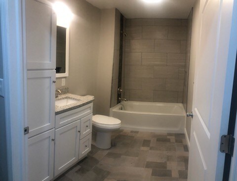 Second bathroom with tile surround. - 330 E Niagara St