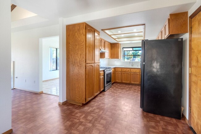 Building Photo - Corner Lot 4BR with Vaulted Ceilings & Big Yard