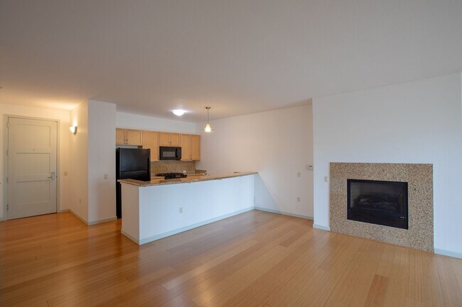 Building Photo - Sweet + secure 1/1 condo with parking, extra storage room + AC available now!