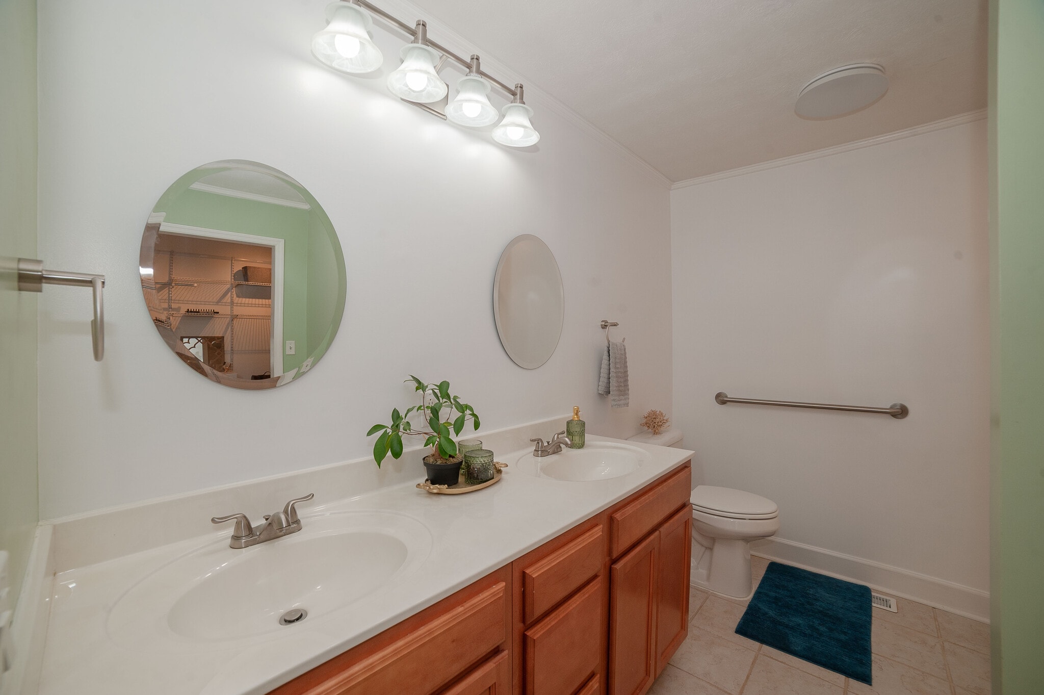 Dual-sink vanity with ample storage. - 6812 Uppingham Rd