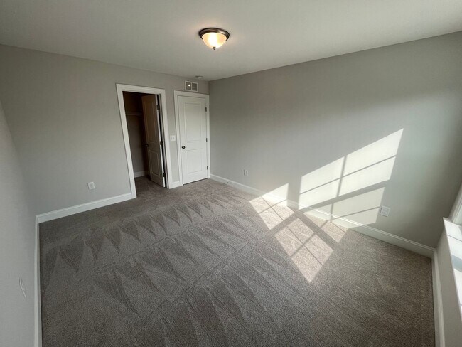 Building Photo - Newly Built 4BD, 3BA Cary Townhome with Modern Amenities and Screened-In Patio