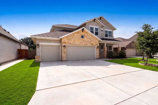 Building Photo - Greenbelt. 3 Car Garage. Built In Dog Room.