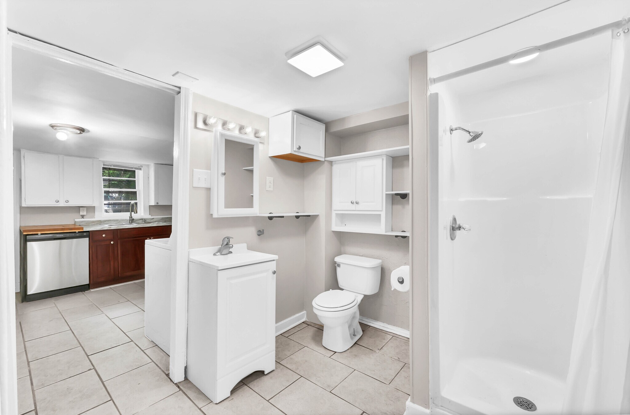 Fully remodeled bathroom with ample storage space. - 1 Proctor Dr