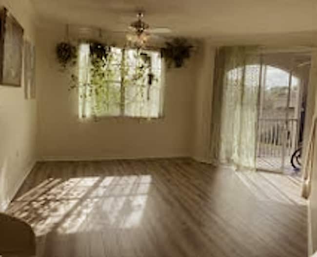 Living room with new floor - 5601 Bentgrass Dr
