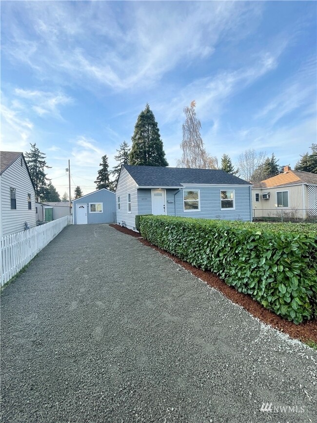 You can see unit B in the background, and main house in front. - 6944 S Stevens St