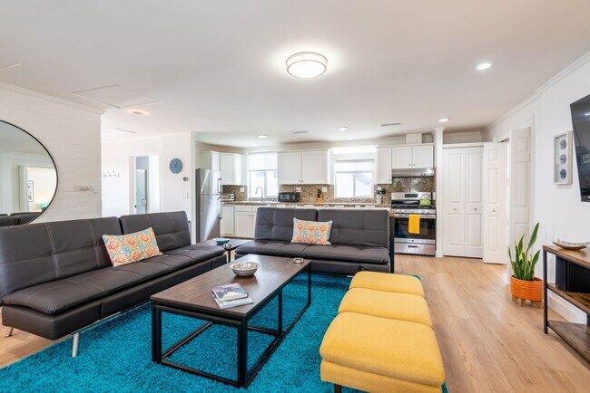 Building Photo - Enjoy stunning sunsets and beach living at its finest, Short Walk to Beach