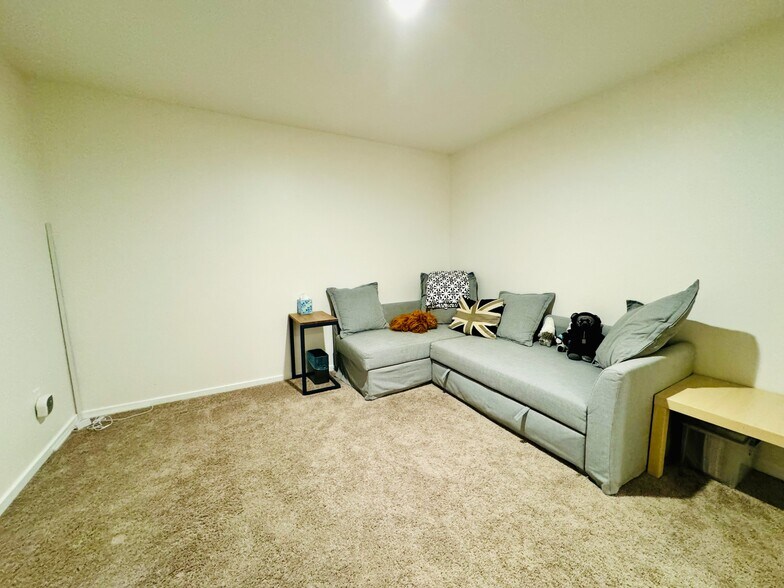 A room perfect for guests, a home office, or creative space, with comfortable layout. - 2145 Dexter Ave N