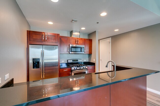 Building Photo - Iconic Strip-View Luxury | Elegant 1BR + Den High-Rise Residence