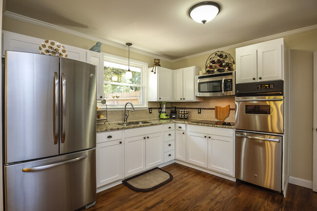 Photo 16. Kitchen with gleaming white cabinets - 1623 Lethia Dr