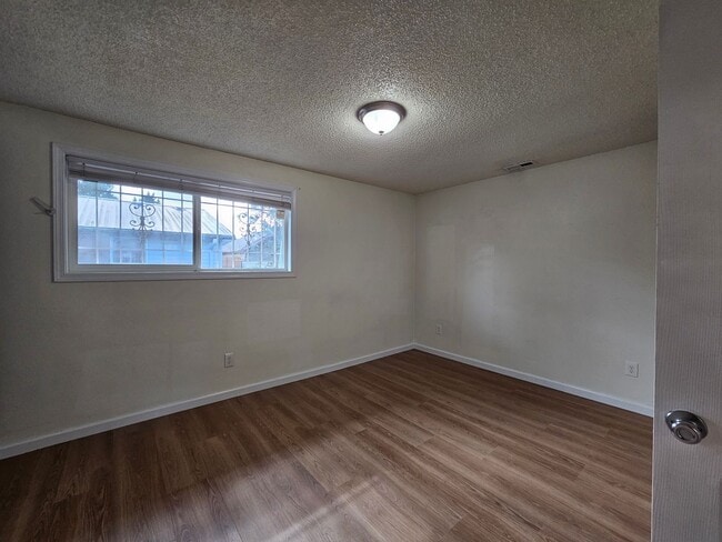 Building Photo - Charming Single-Level Home Featuring New Hardwood Floors, Bright Bedrooms & Open-Concept Living