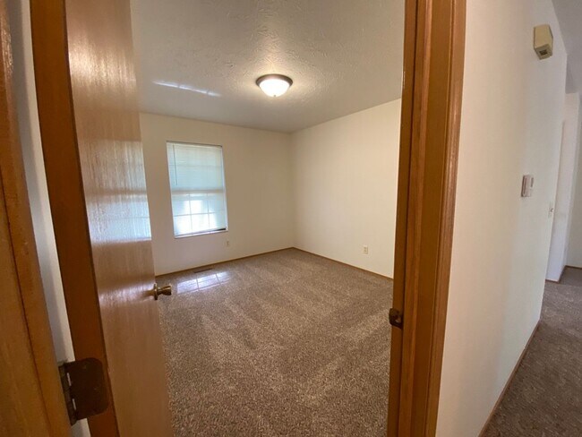 Building Photo - Three bedroom, two bathroom, two car garag...