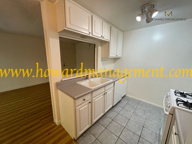 Building Photo - Bonus Den! Beautiful lower condo with large patio in Tara Hills, a resort style living complex!