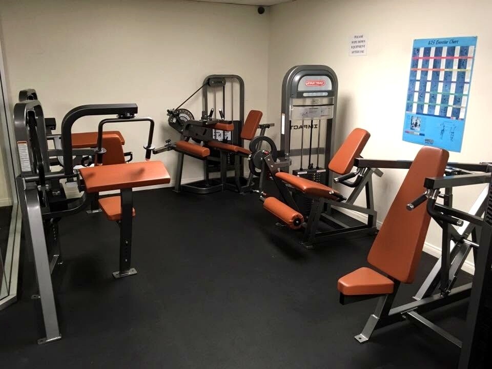 Fitness center with strength-training equipment - 8305 Summertime Ln