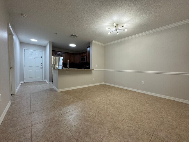 Building Photo - Oviedo 2/2 Condo with Tile & LVP Flooring, Updated Baths, New Paint & Appliances!