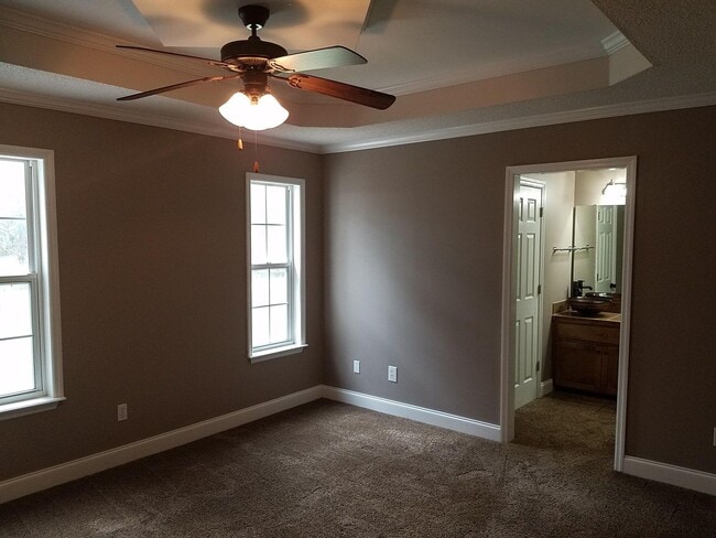 Building Photo - Spacious 3BR Brick Home with Open Split Floor Plan & Tiled Back Porch on Nearly an Acre