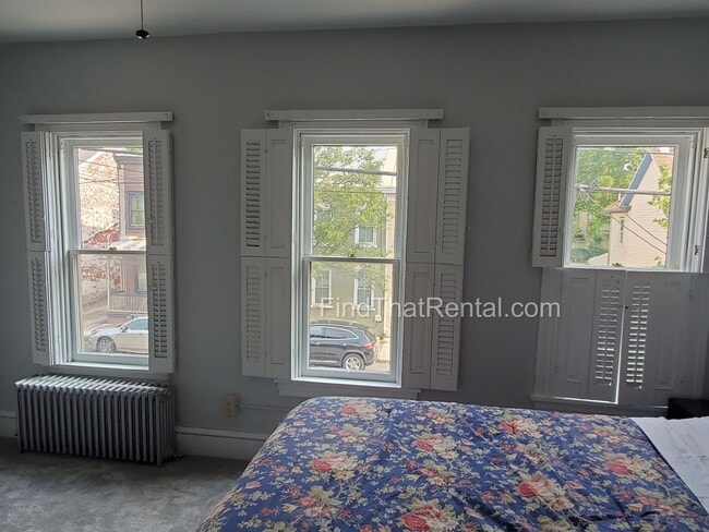 Building Photo - Charming Historic Retreat with Private Fenced Yard & Parking – Prime Downtown Location