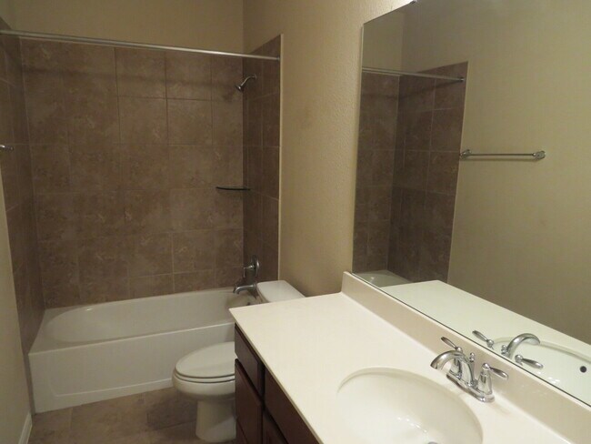 Building Photo - "Charming 4-Bed Oasis with Granite Touches...