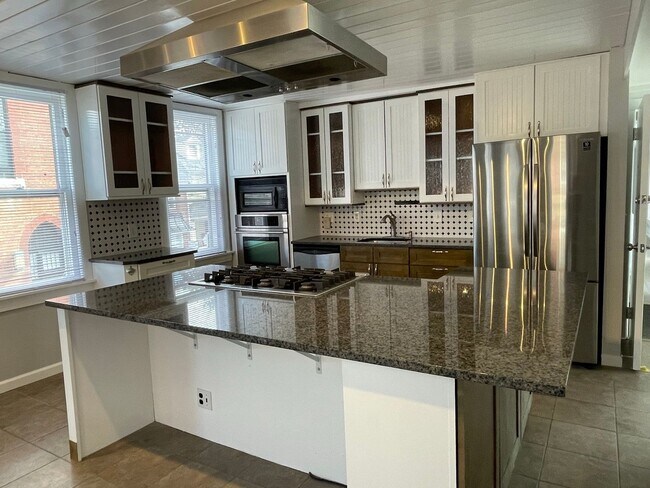 Building Photo - Small pets are welcome with an additional ...
